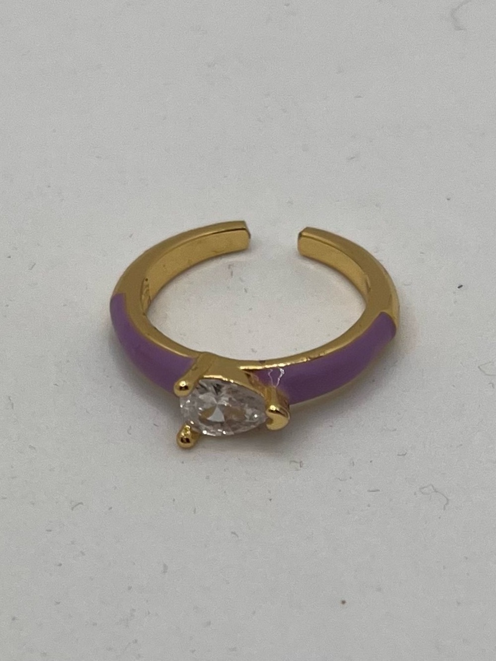 Two Gold Tone Purple Enamel Rings with Pear-Shaped Clear Stone